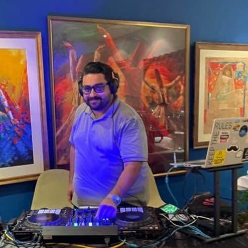 DJ Justin performing with professional DJ equipment