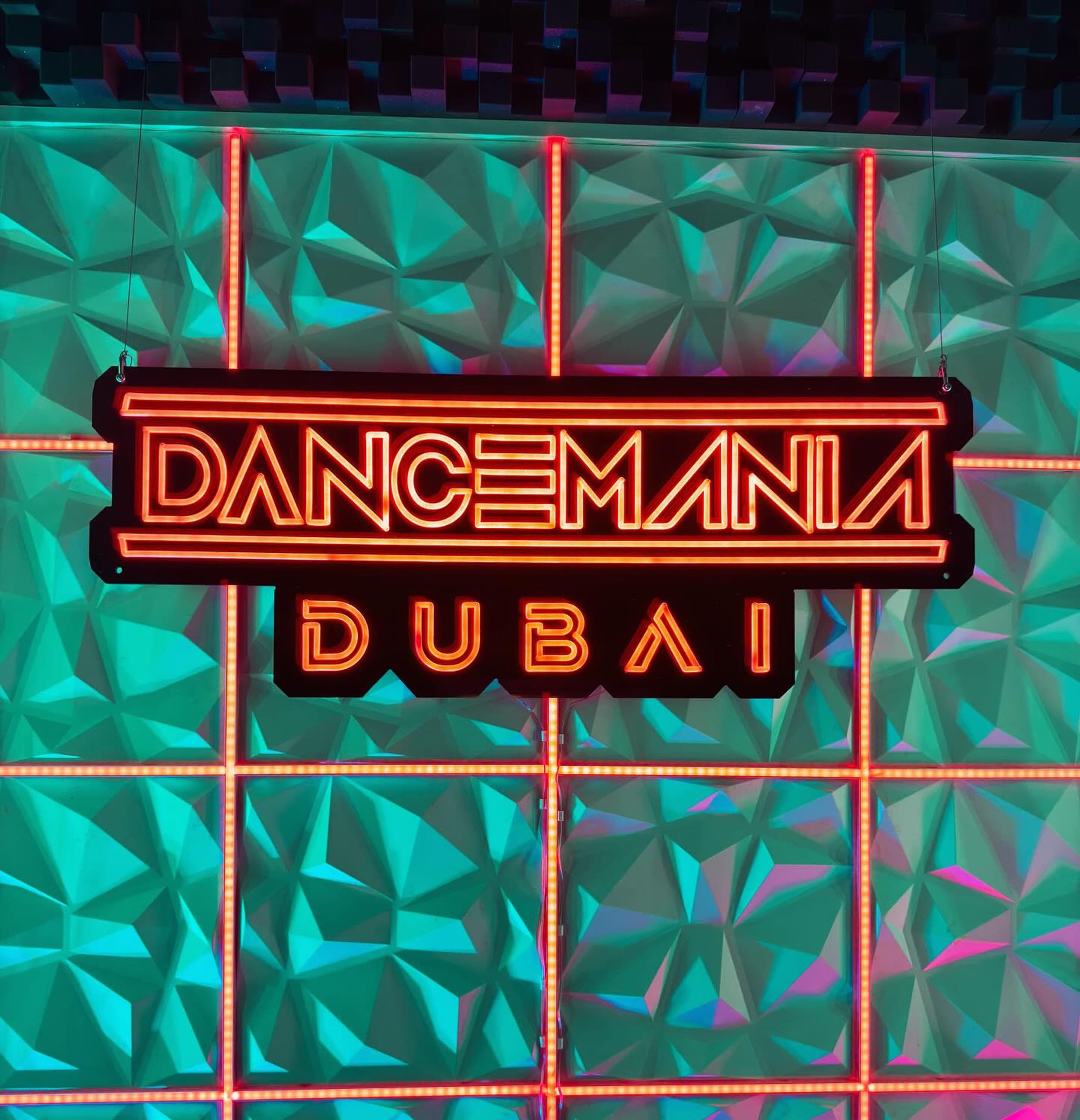 Dancemania Dubai branded studio and neon sign
